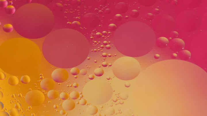 Photo of orange and red coloured bubbles in a liquid. From e1011 Labs' terpenes information page.